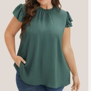 BloomChic Blouse with mock neck, cap sleeves, ruffles.